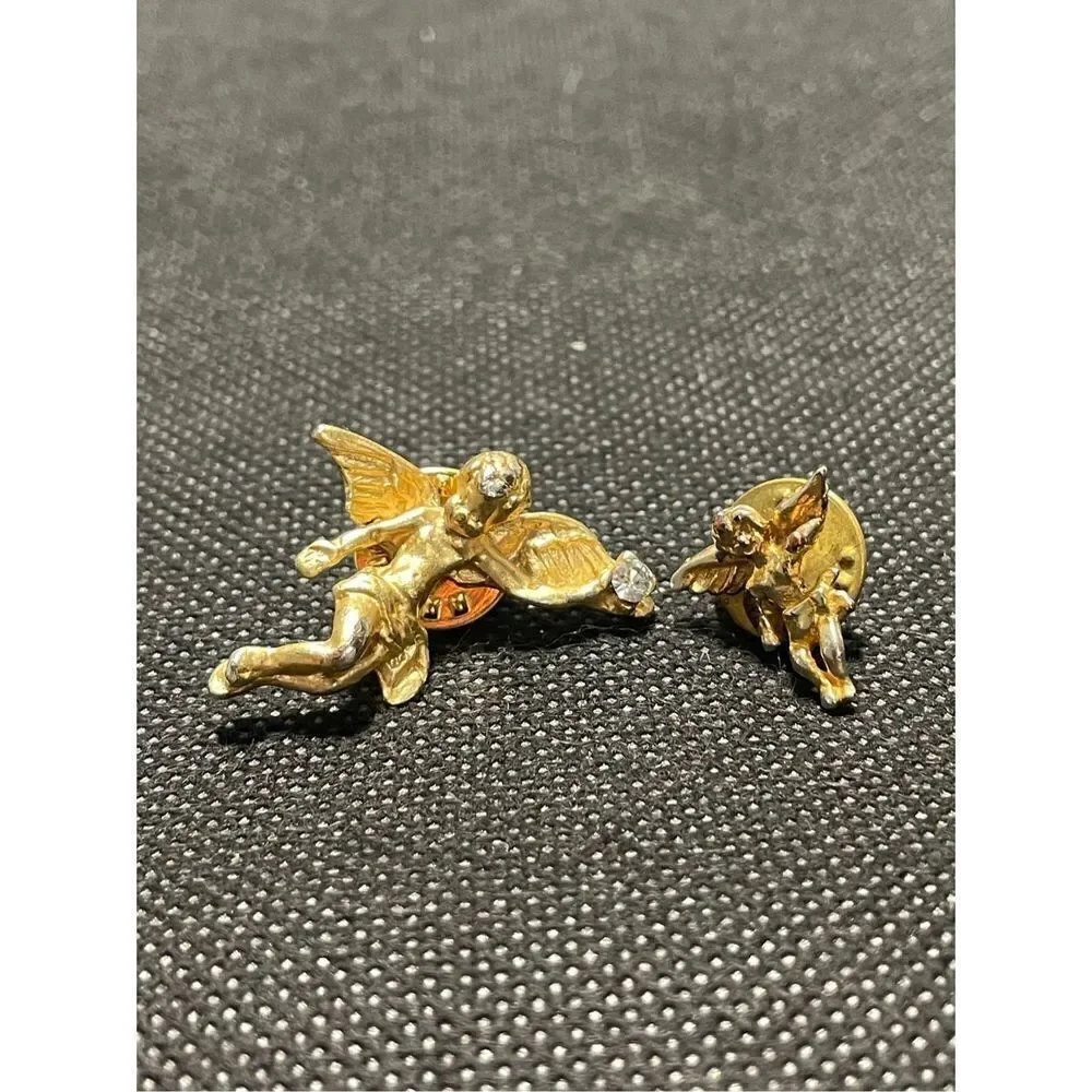 Two cherub pins￼
